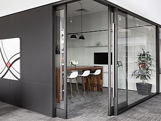 GL Seaman & Company Fort Worth Small Conference Room enclosed in glass with GL Seaman & Company Logo on the wall