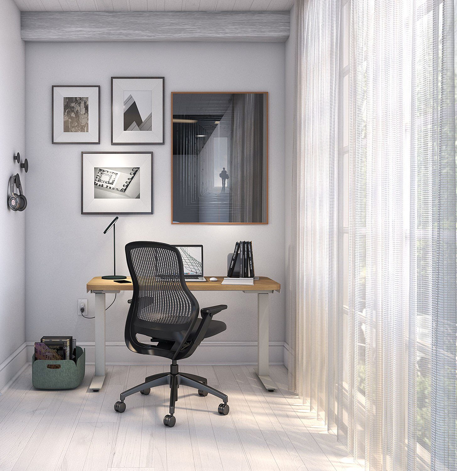 home office setup with black ergonomic task chair and a sit-stand desk
