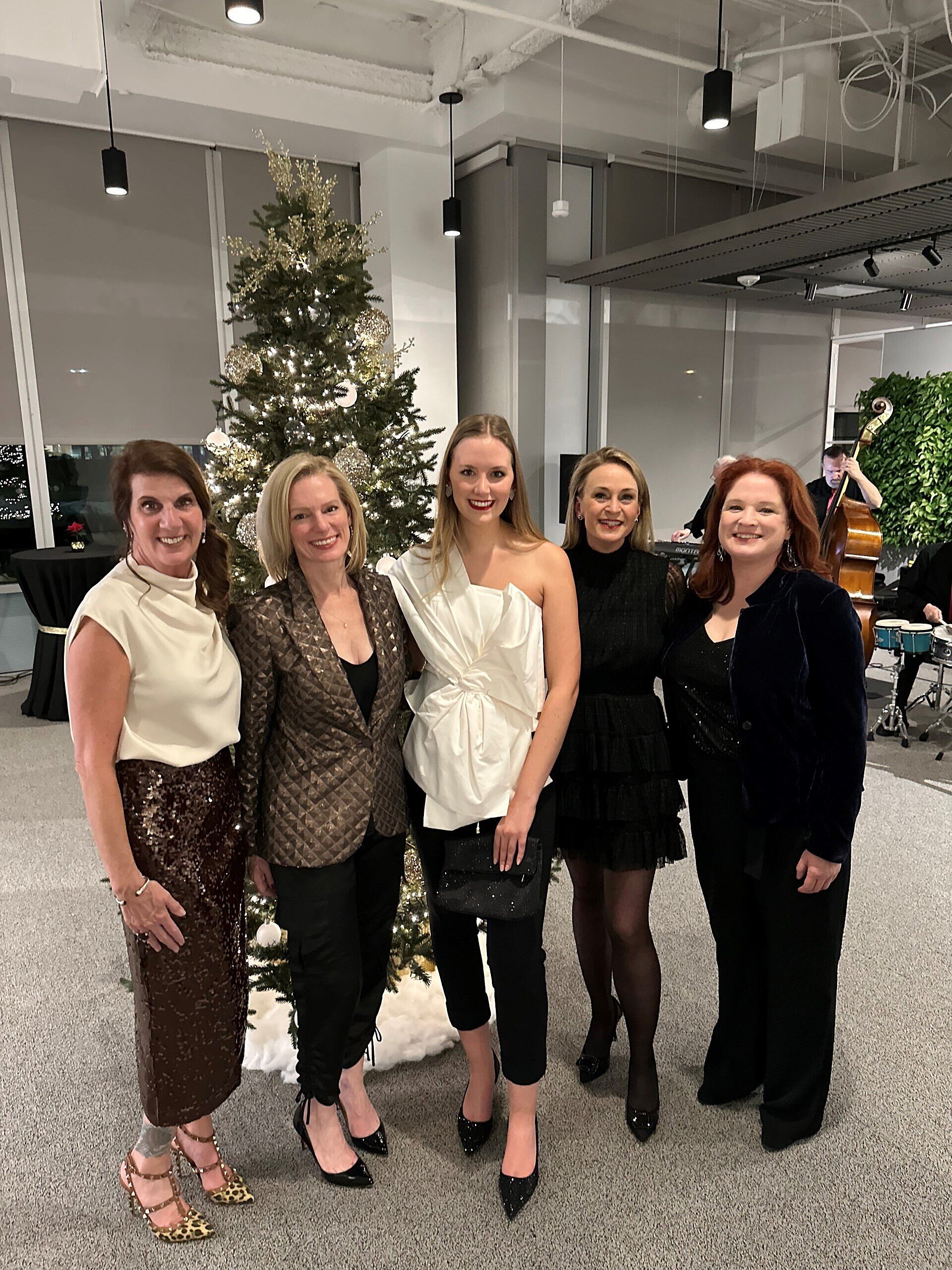 Corporate Holiday Party 5 women standing and smiling for a picture