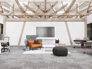 GLSC FW Showroom with lounge seating, a desk with a task chair, and a DIRTT Timber Frame