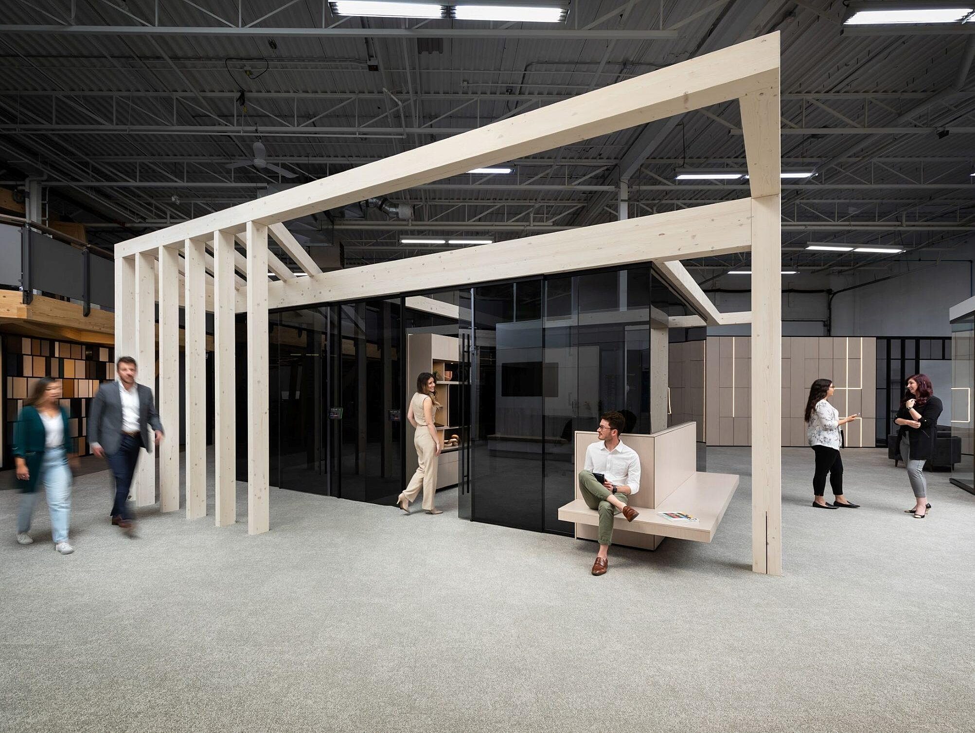 DIRTT Timber Structure around a private office enclosed in glass in a corporate office
