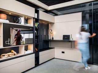 DIRTT customizable shelves with a tv in the middle