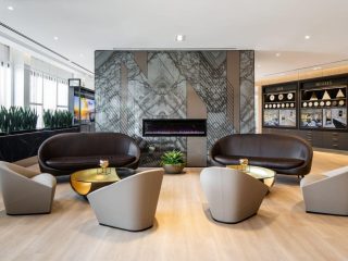 Custom graphic with a grey and brown pattern on DIRTT Willow Glass walls