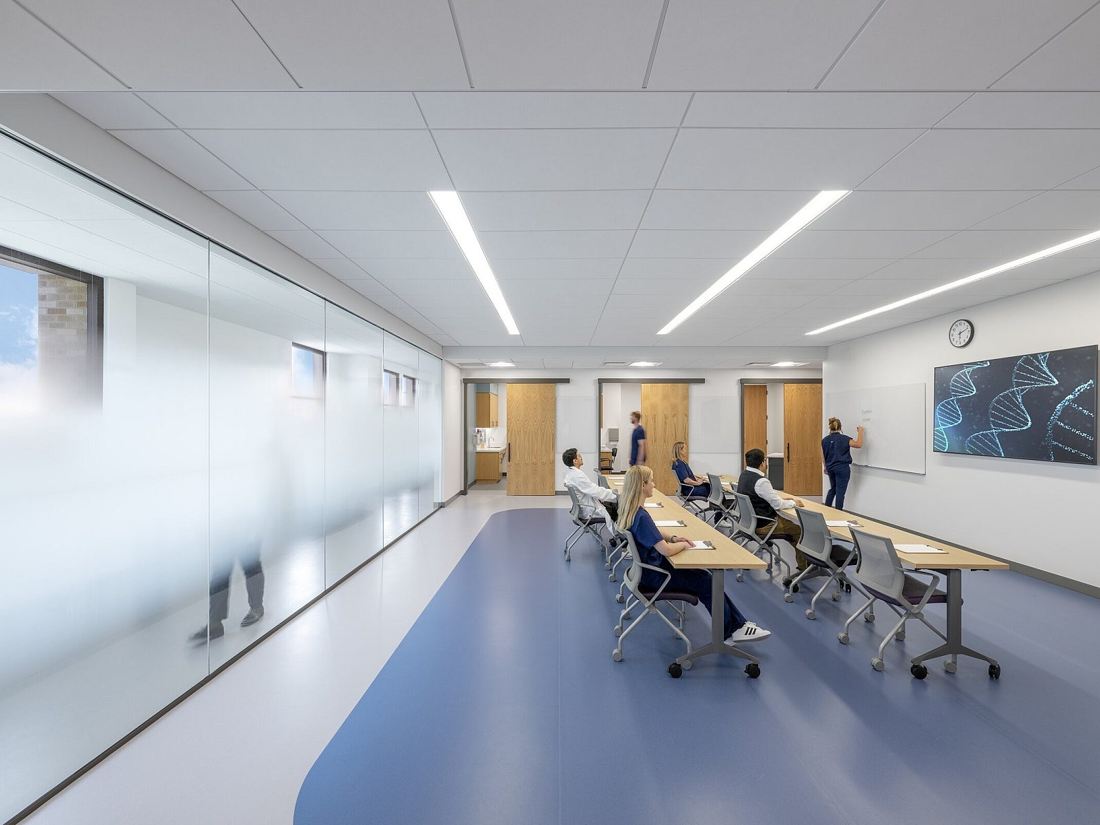 Students learning from professor in TCU Burnett School of Medicine Classroom