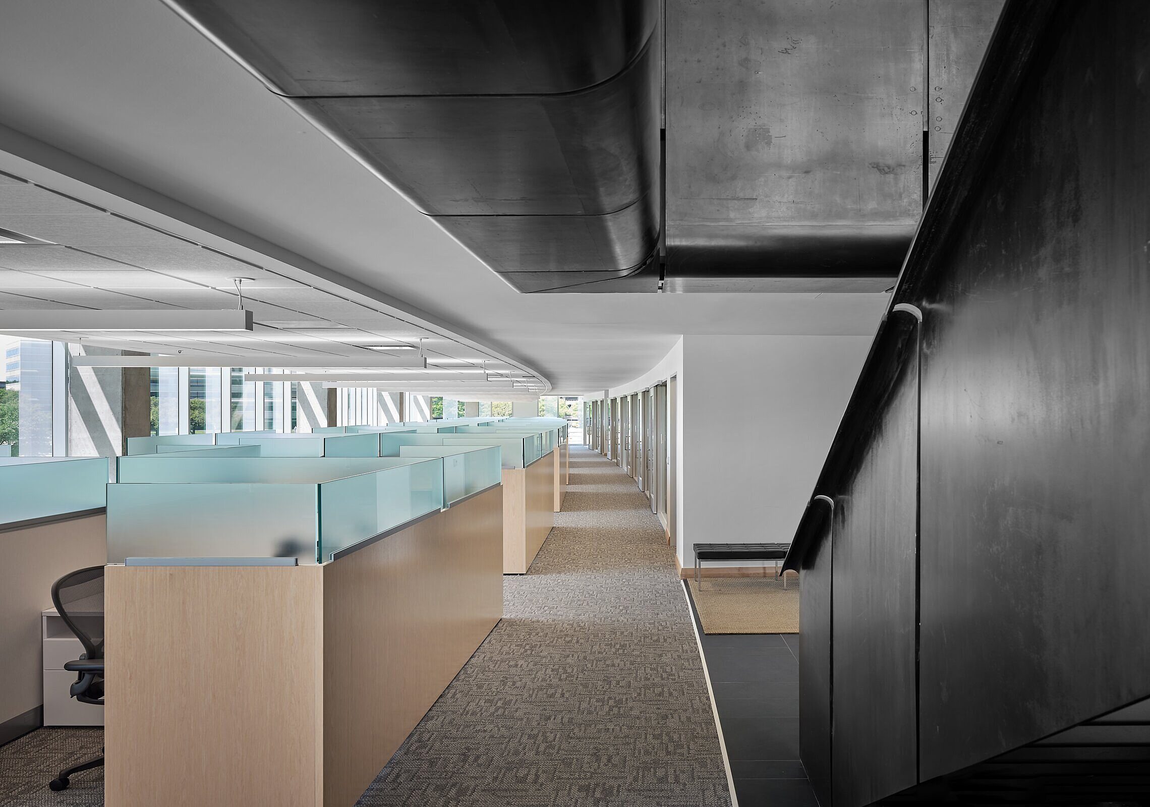 State Bank of Texas workstations to the left and charcoal grey stairs to the right