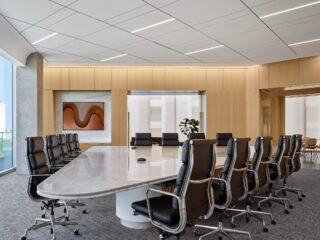 State Bank of Texas Conference Room with large marble table and black leather chairs