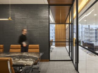 Luxury Automotive Sales Group Conference room with marble conference table and brown leather chairs