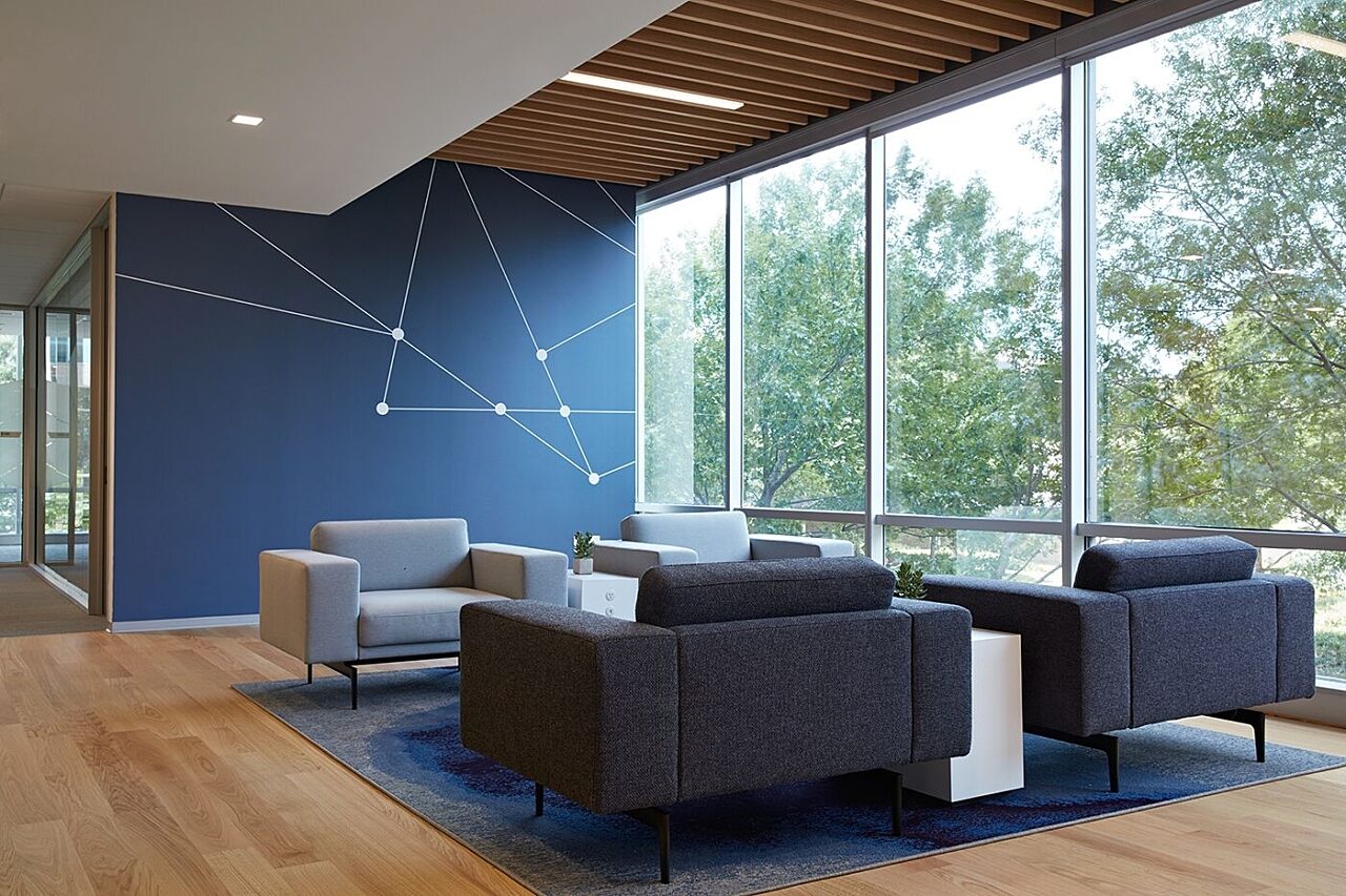 common area seating in corporate office with 4 chairs and a coffee table