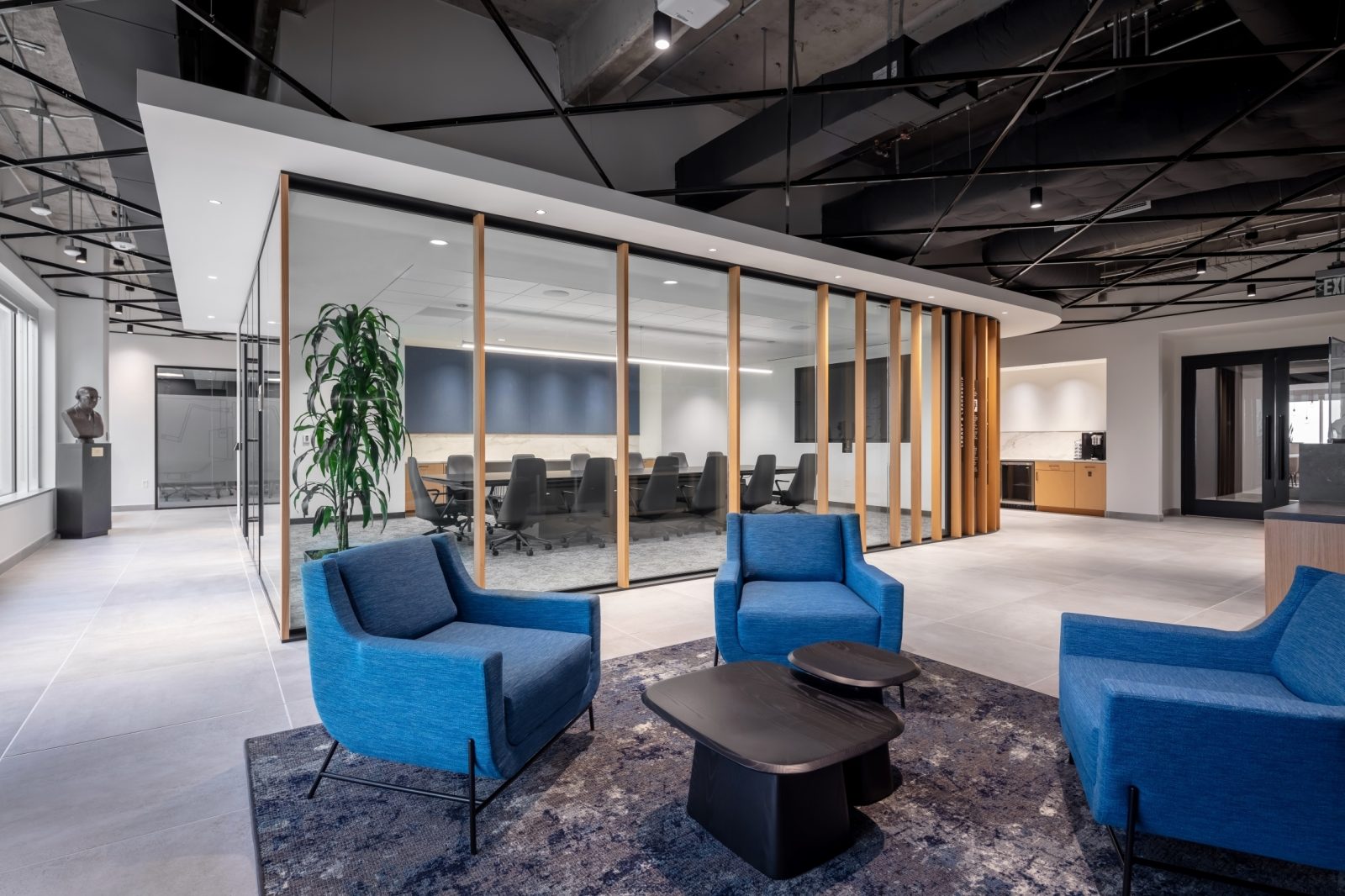 corporate office seating area with chairs and a coffee table