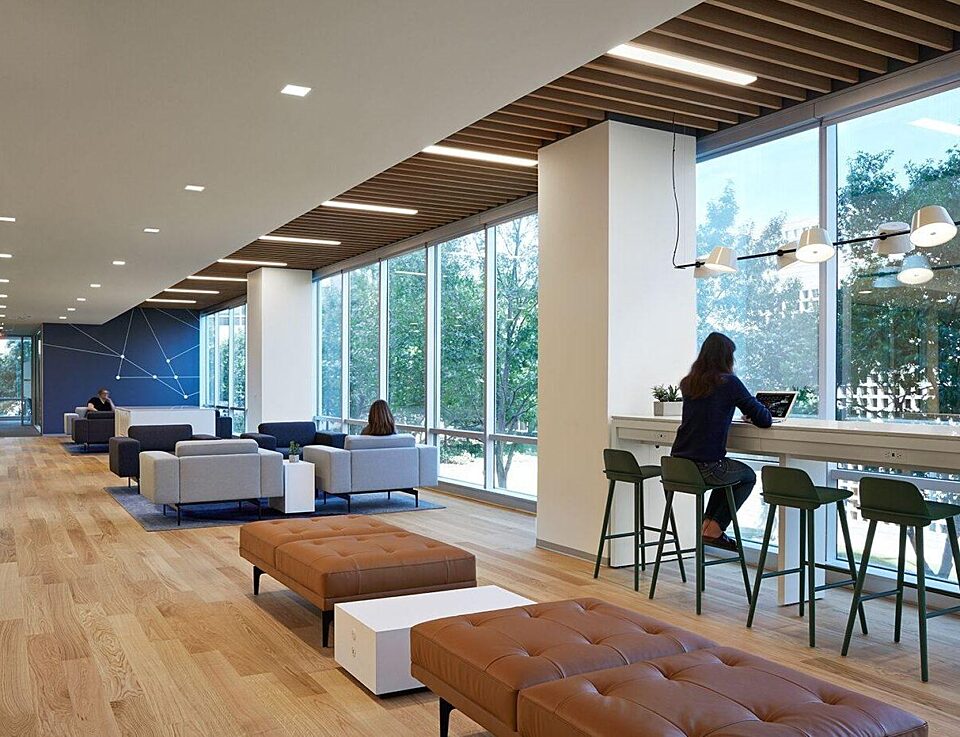 corporate office common area with benches, counter tops with stools, and seating areas with chairs