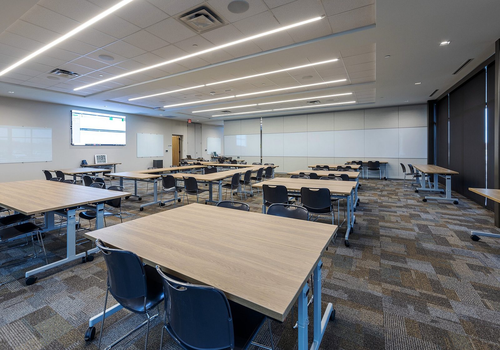 eagle mountain isd classroom with wooden desks and 4 chairs at each desk