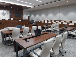 Courtroom space with Global white chairs and jury seating