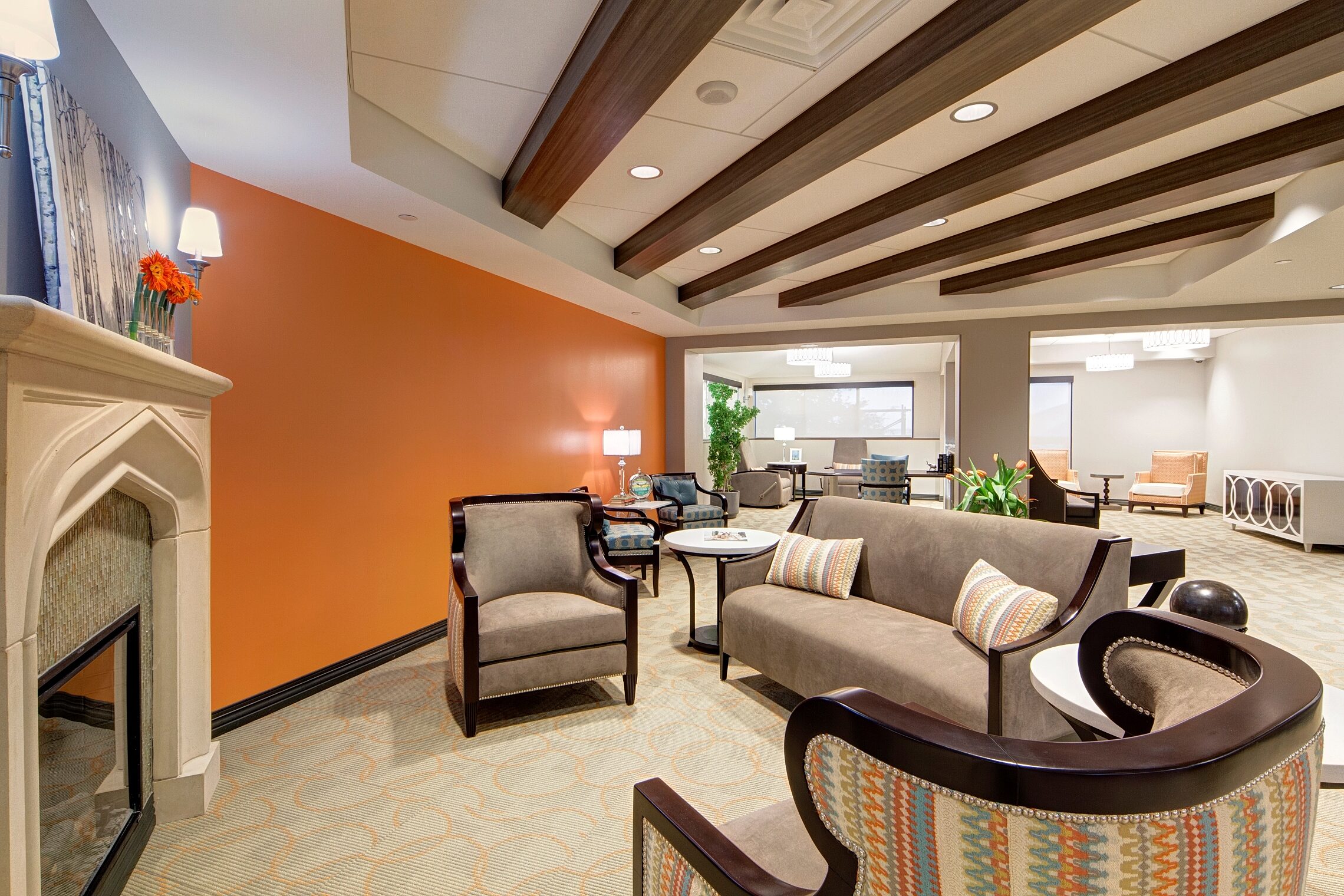 Healthcare facility living room seating area with chairs and a couch